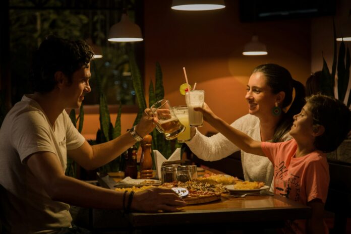 Photo by Pablo Merchán Montes three people having a toast on table