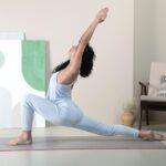 나이 들수록 몸이 굳는 진짜 이유: 안티에이징 스트레칭 a woman doing a yoga pose in a room